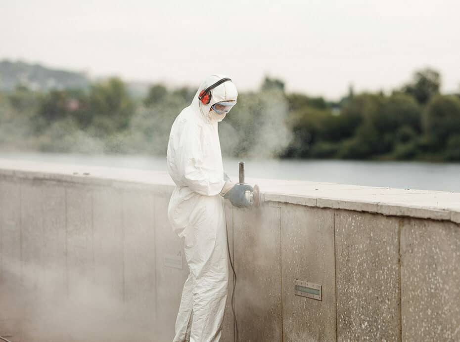 Industrial hygiene monitoring professional conducting tests to ensure worker safety and OSHA compliance.